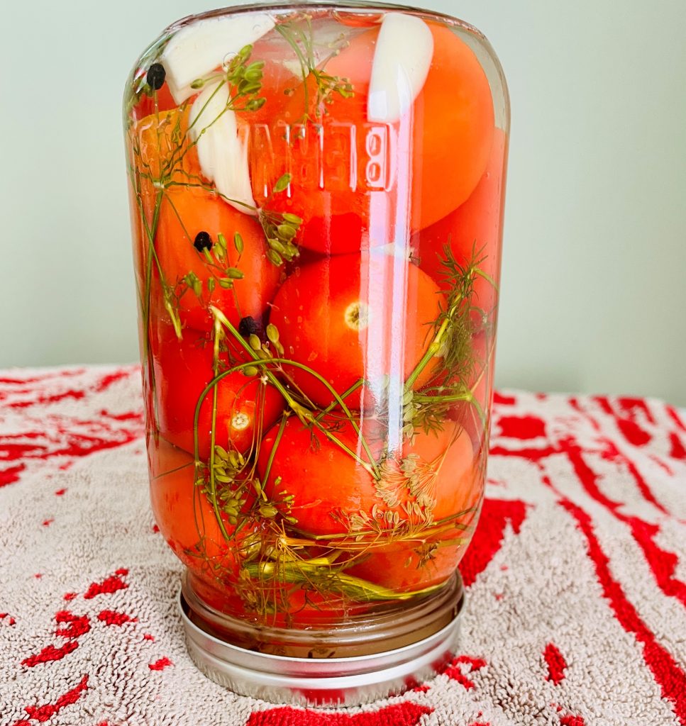 invert the jars - this is how you can whole tomatoes without a canner