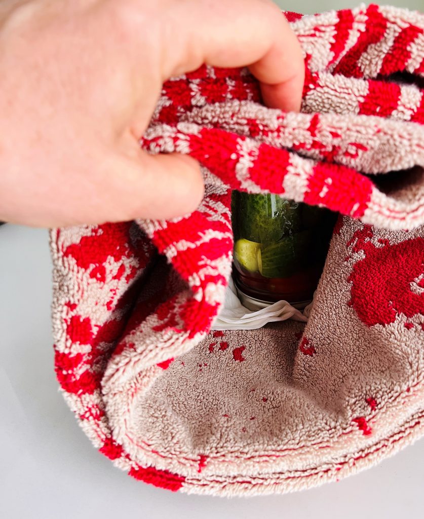 wrap inverted jars in warm towels. this is mandatory for open kettle canning