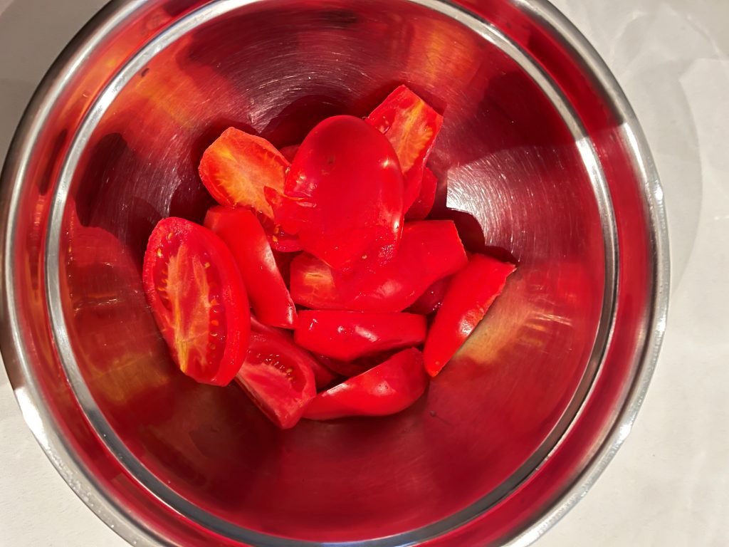 remove tomatoes cores and cut them in halves