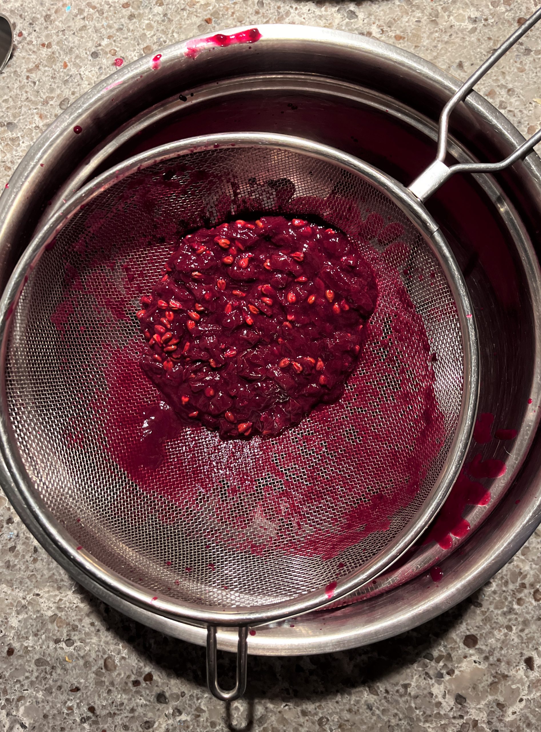 Concord Grapes Jam Recipe: strain the cooked grape jam through a mesh colander