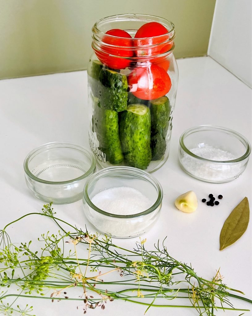 tomatoes, cucumbers and pickling brine ingredients