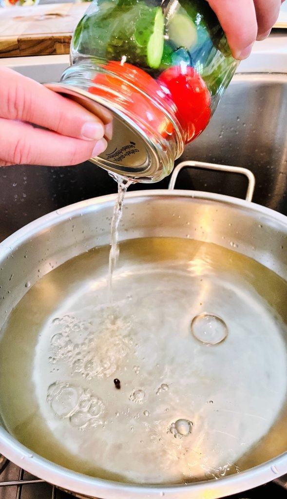 pour water from the jar back into the pot