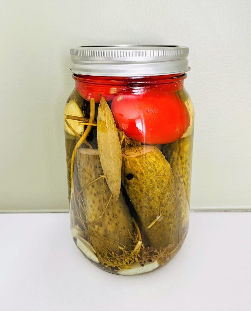 Tomatoes and dill pickles in one jar. Deliciosly crunchy!