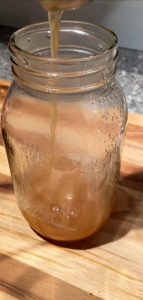 pour piping hot juice into sterilized mason jar