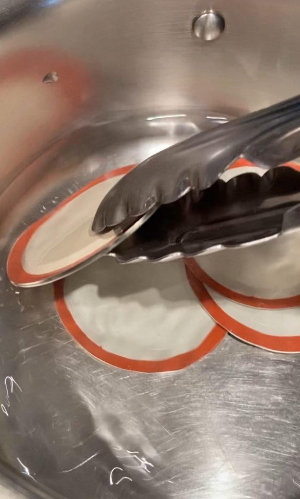 sterilizing jar lids in boiling water