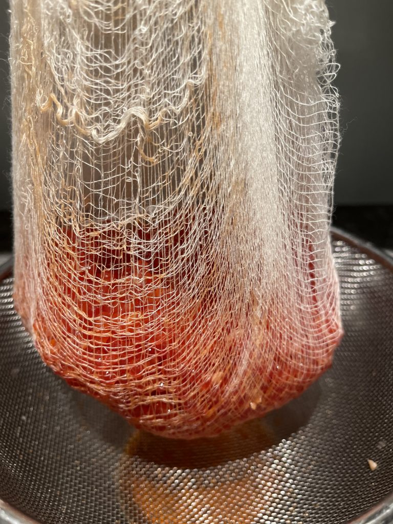 Spoon the salmon roe onto the cheesecloth-lined strainer