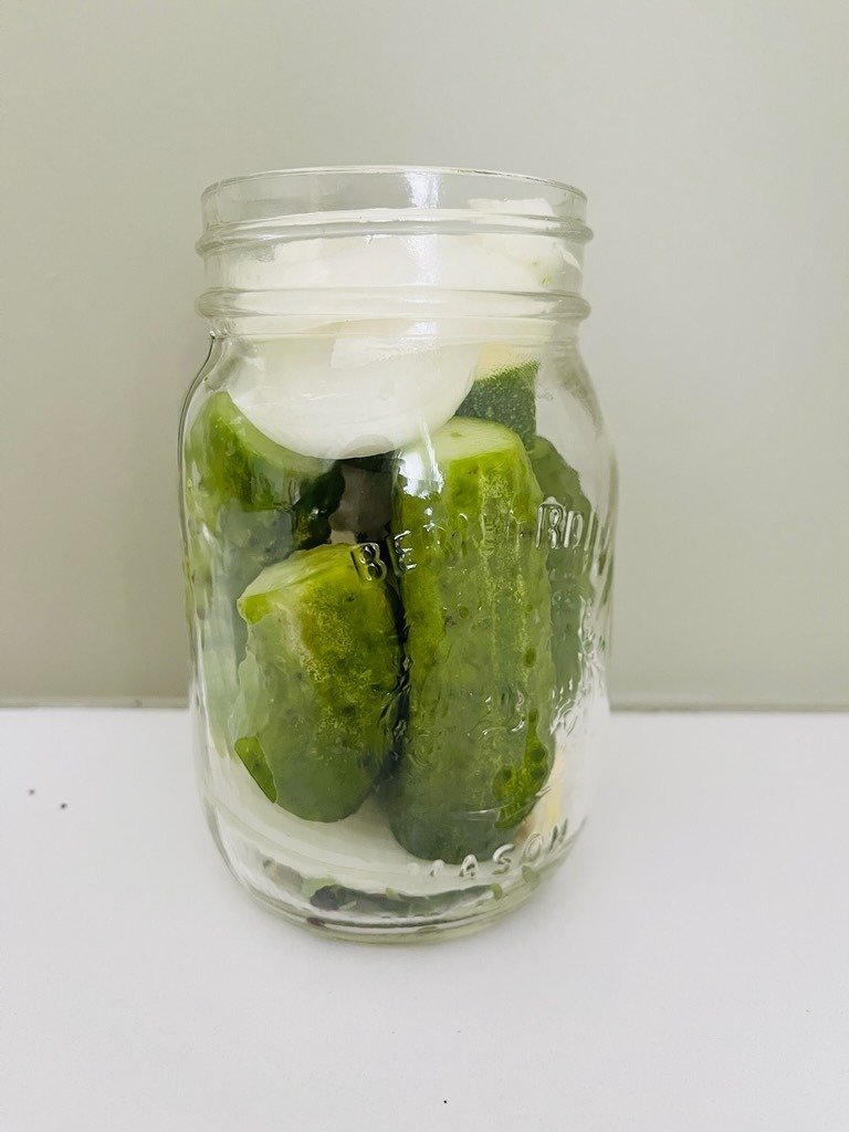 tightly packed vegetables in a jar