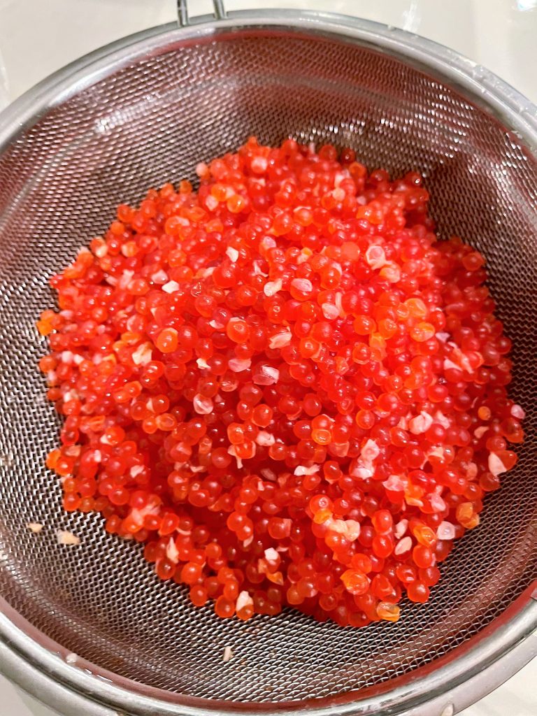 drain the freshly salt-cured salmon roe  