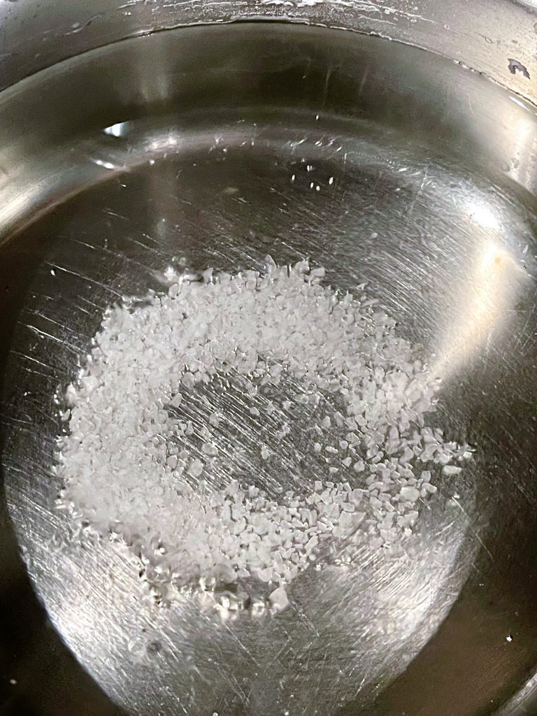Stop adding salt when it no longer dissolves in water