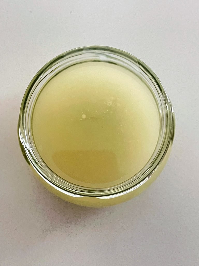 pour rendered beef tallow into a storage container