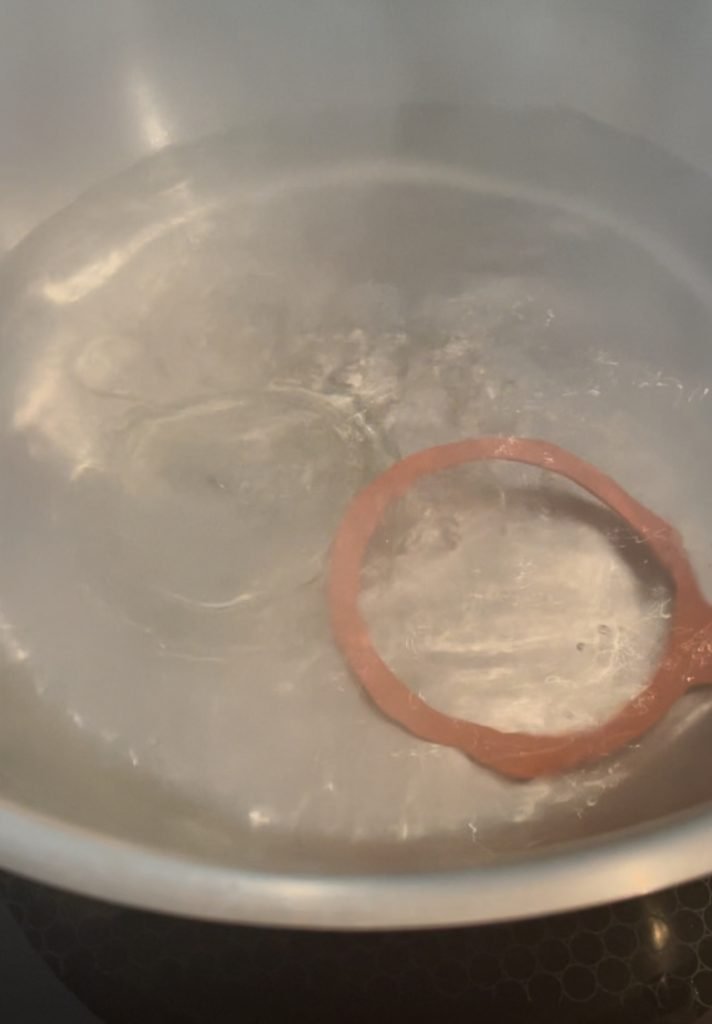 rubber gasket does not want to stay attached to a glass lid when sterilizing