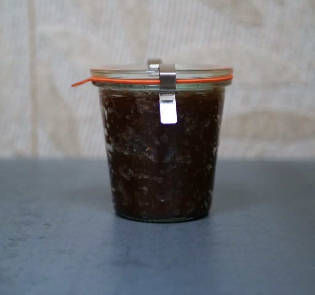 WECK Mould jar filled with jam. The tab pointing downwards