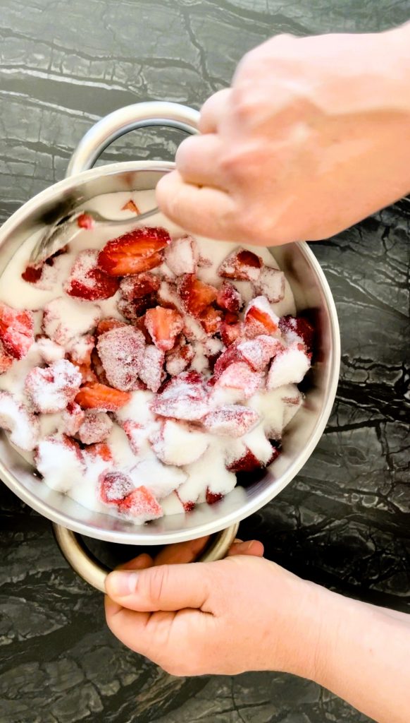 mix chopped strawberries with sugar