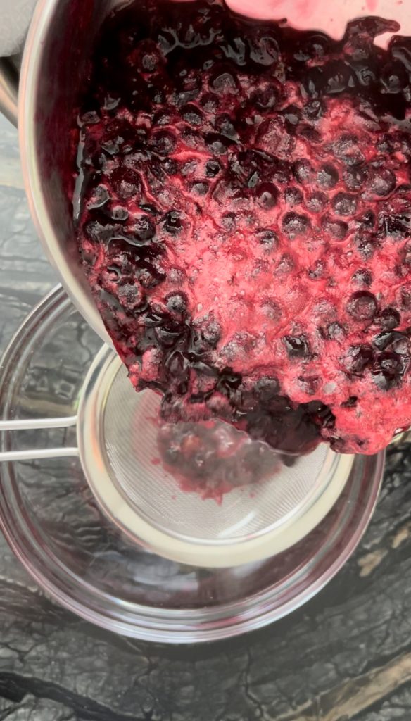 strain cooked blackcurrants