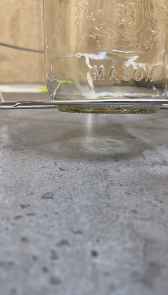 the design flaw of this canning rack will make jars touch the bottom of the canner