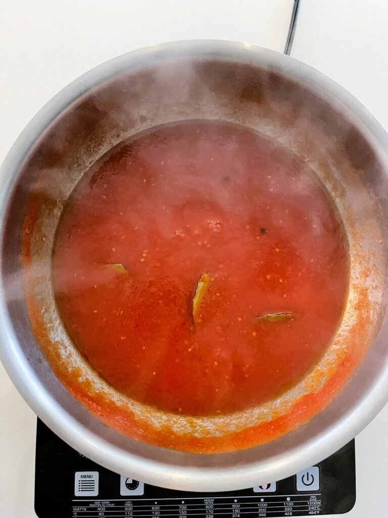 bring crushed tomatoes to boil