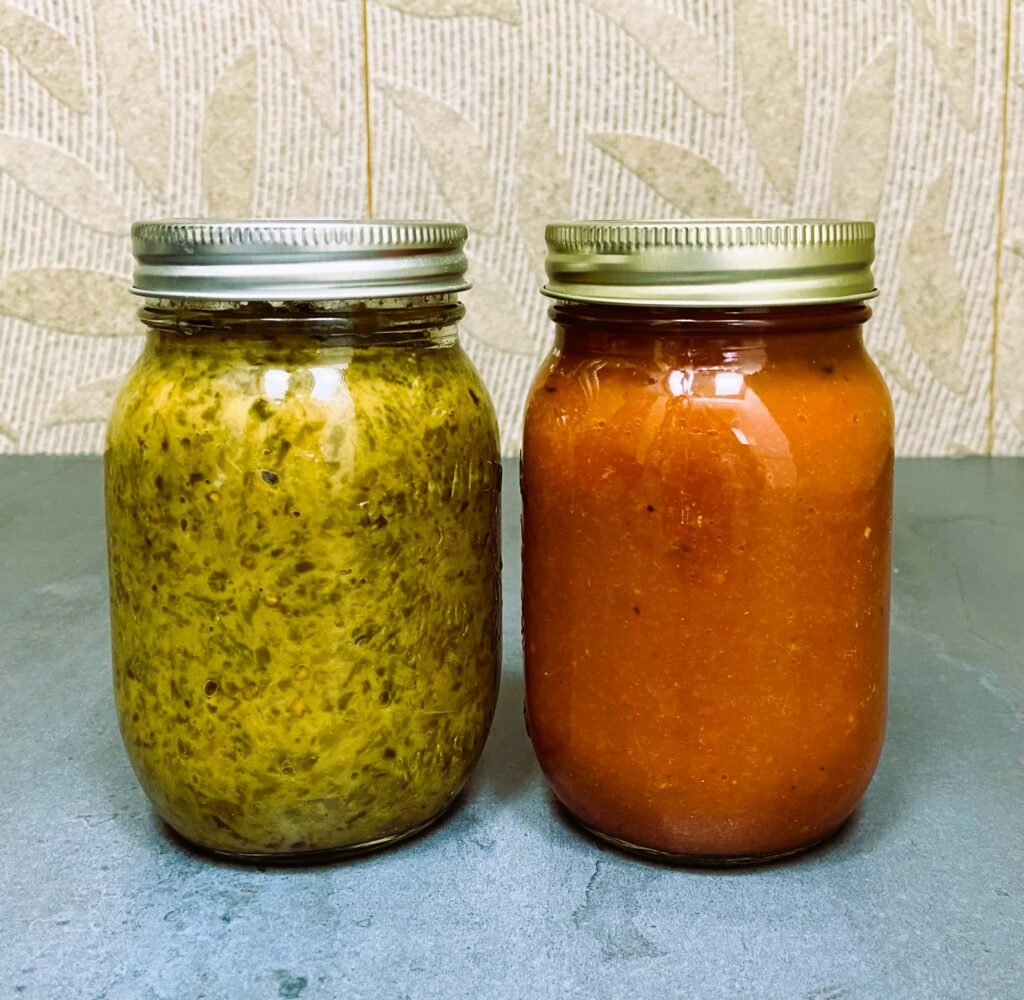 side-by-side comparison of malidzano (green ajvar) and ajvar (red pepper avjar)