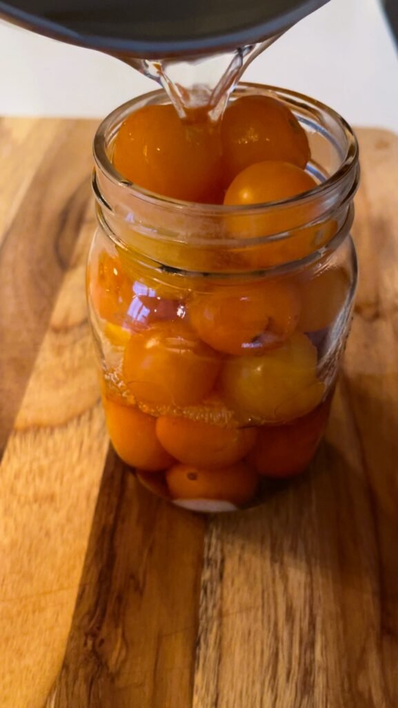 pour hot pickling brine into jars