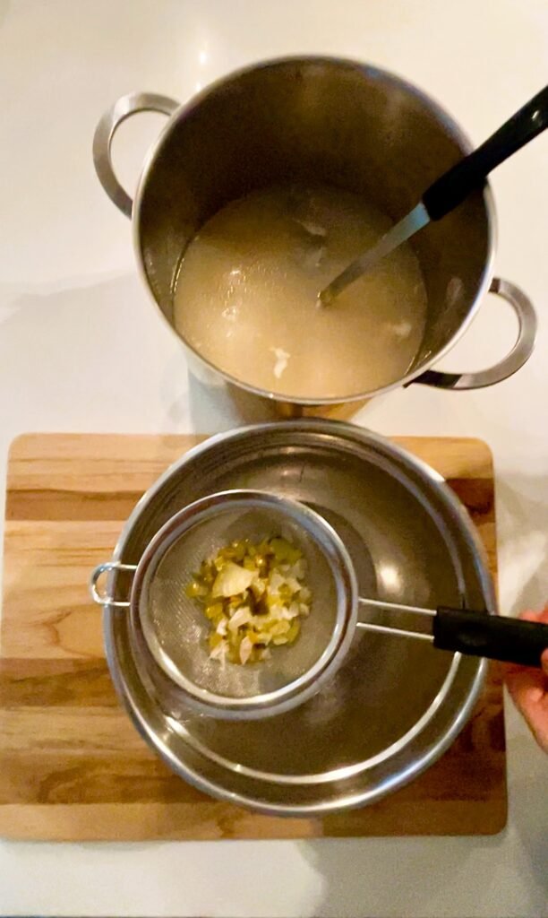 we use fine mesh strainer to strain this cooked fish stock