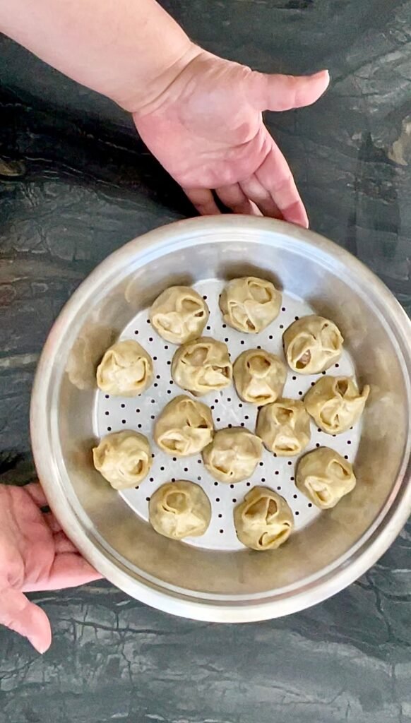 use steamer basket to cook manti dumplings 