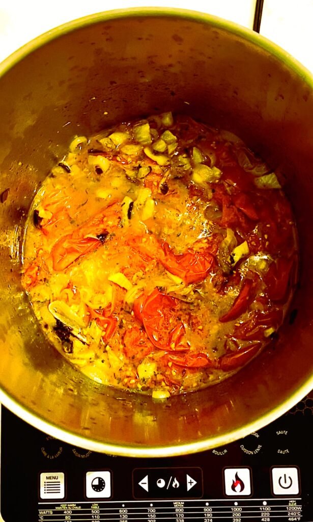 roasted tomato soup ingredients combined in a large stock pot