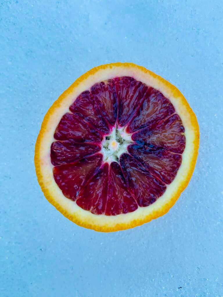 Cut Blood orange on snow