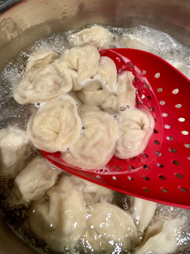 drop frozen pelmeni into boiling water