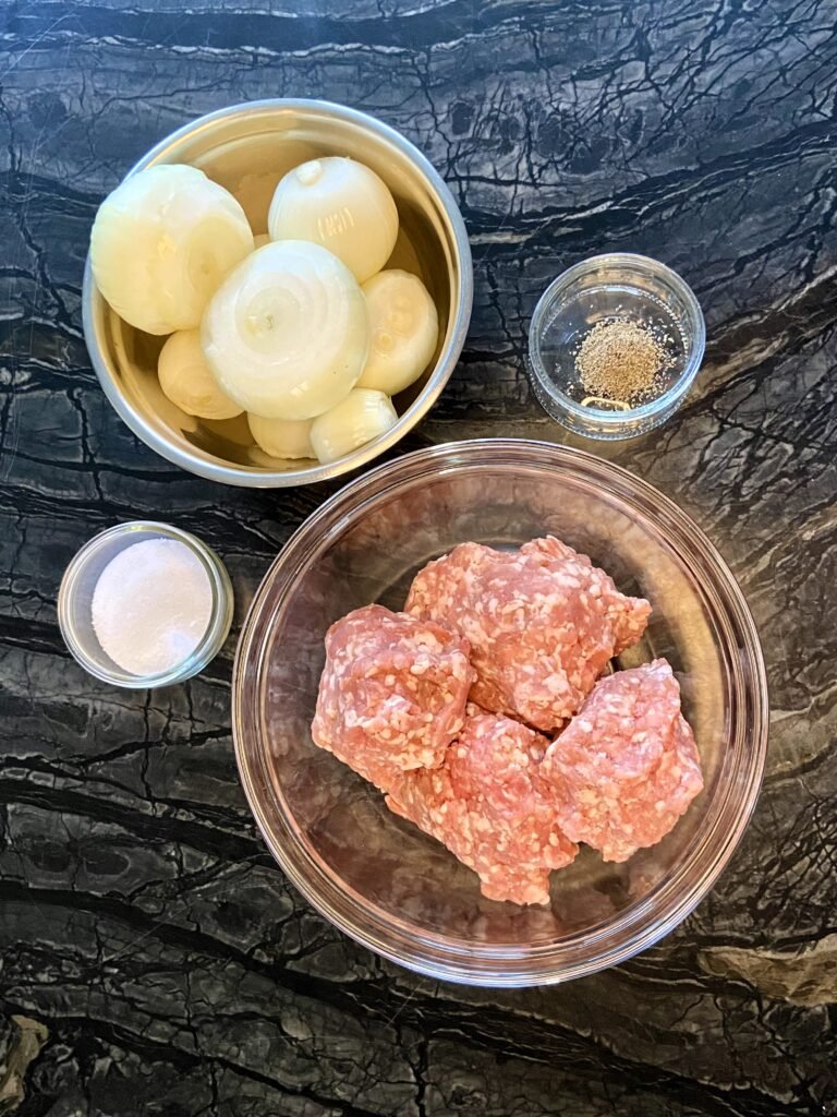 assembled  pelmeni filling ingredients- minced meat, onions, black pepper and salt 