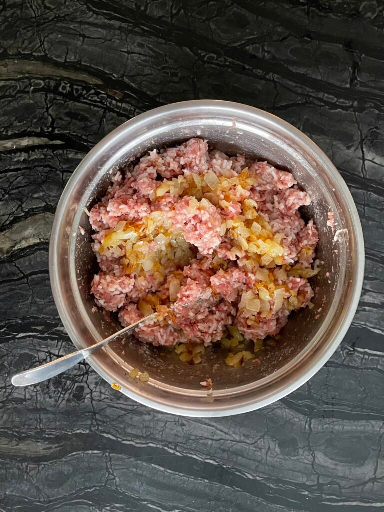 filling mix is made with minced meat, cooked rice and sauteed onions.