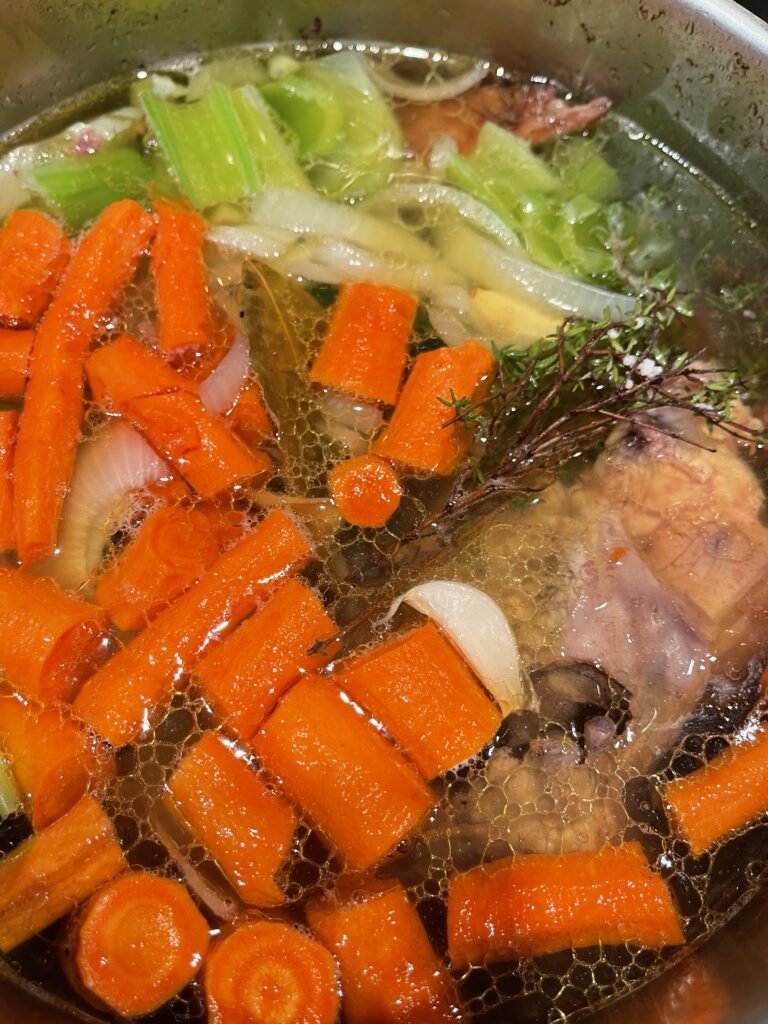 chicken broth with vegetables and bones