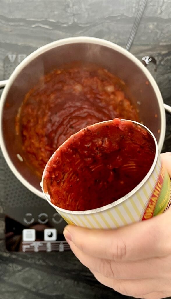 Add chopped canned tomatoes to the rest of the ingredients