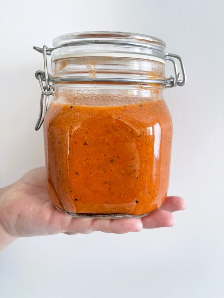 finished cioppino soup base ready for freezing in a freezer-safe jar