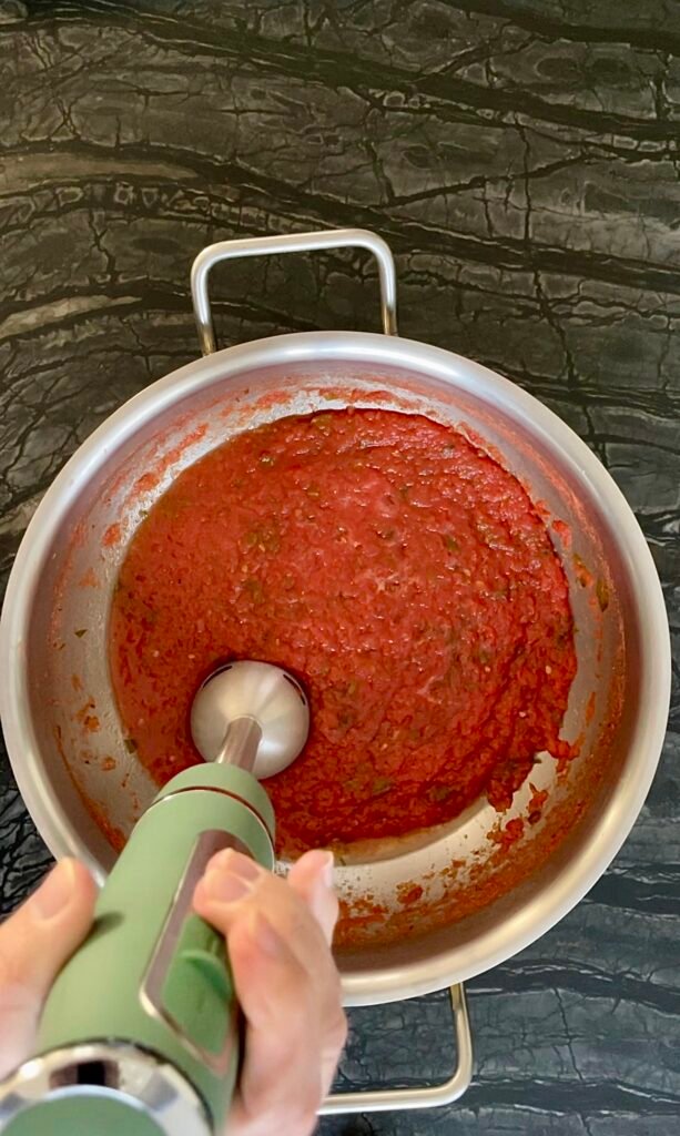  before canning tomato sauce we blend it for smoother texture