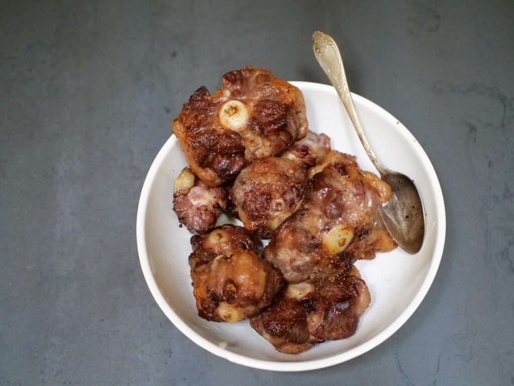 seared oxtails set aside till aromatics are fully cooked