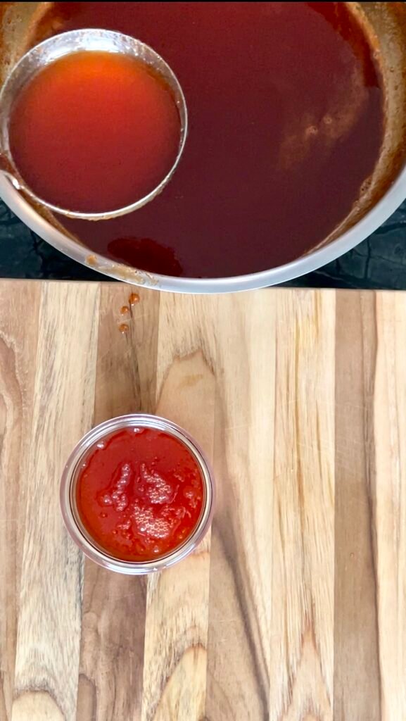ladle red pepper jam mixture into canning jars