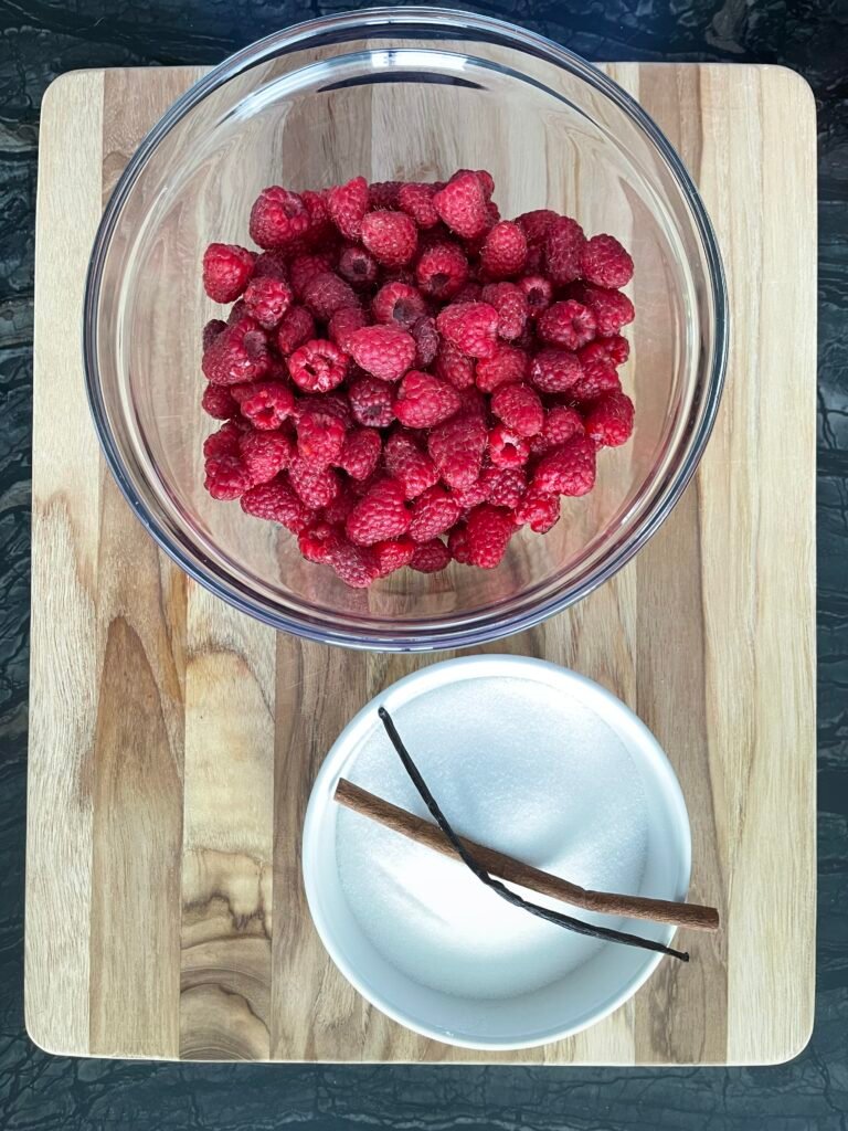 spiced raspberry syrup recipe ingredients - raspberries, sugar, cinnamon and vanilla bean