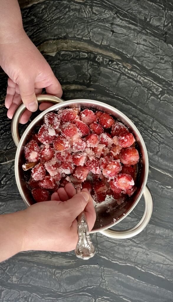 we mix strawberries, cinnamon, sugar and lemon juice carefully so as not to break any strawberries