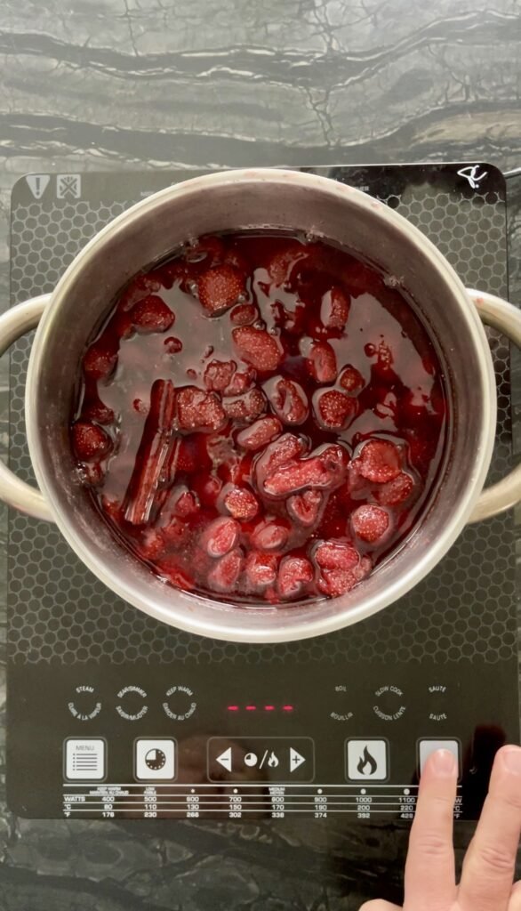 strawberries in a pot before the second round of cooking