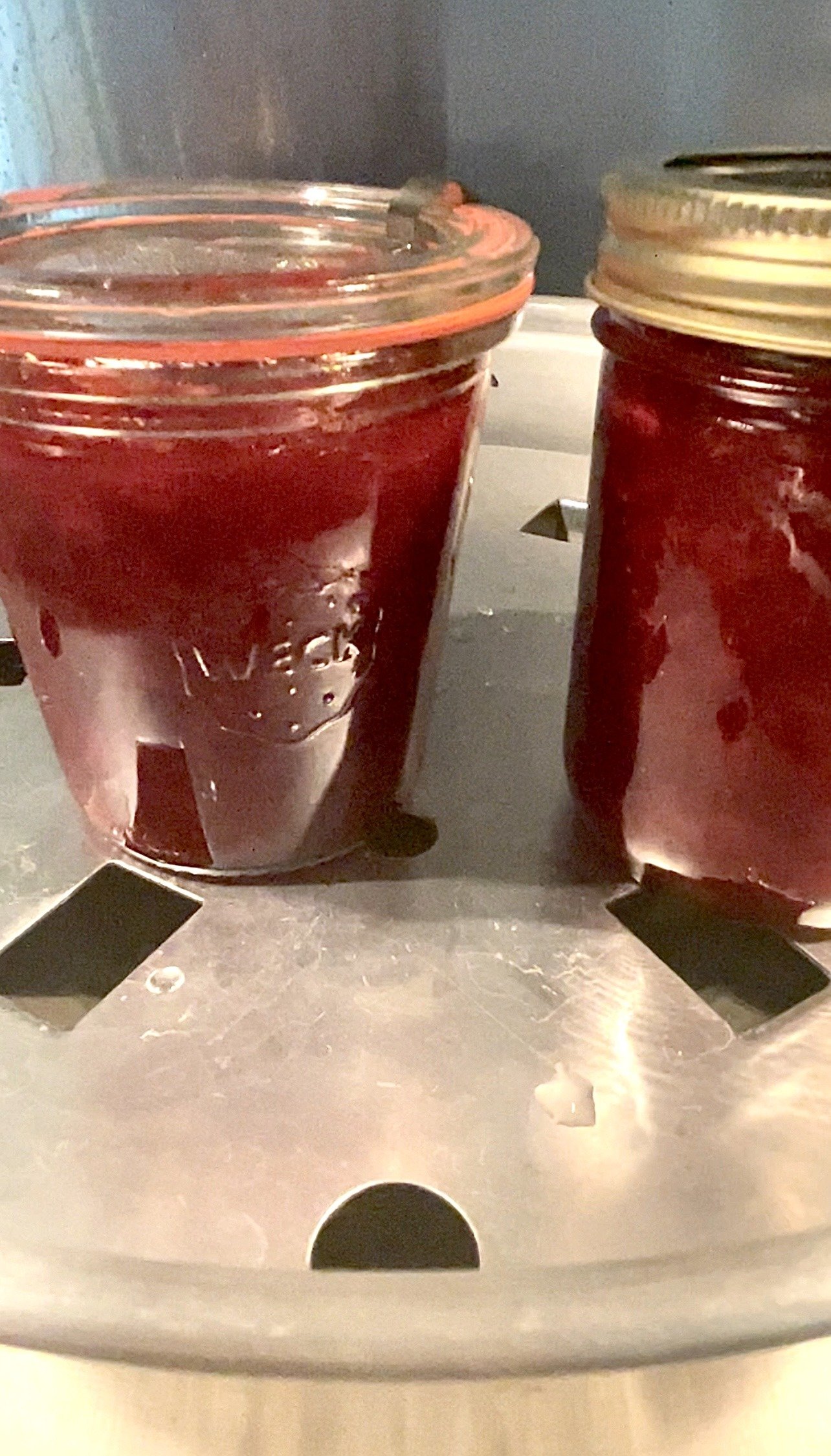jars with rose petal jam get processed in a steam canner
