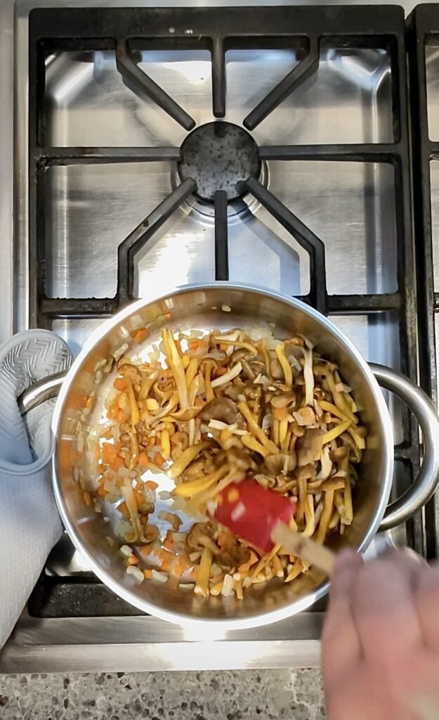 briefly saute wild mushrooms in the same pot as the cooking onions and carrots