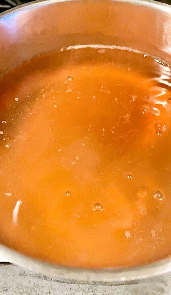 pear syrup after 30 minutes of cooking starts getting light orange color