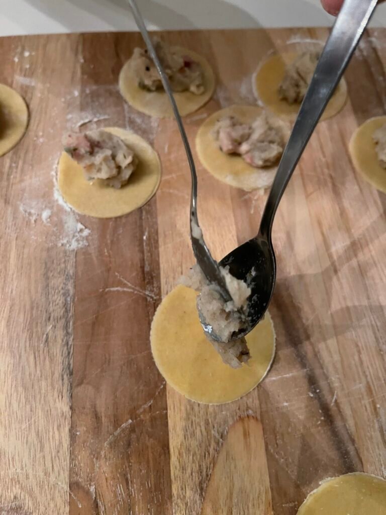 we use two spoons as an alternative to  piping bag to fill tortellini