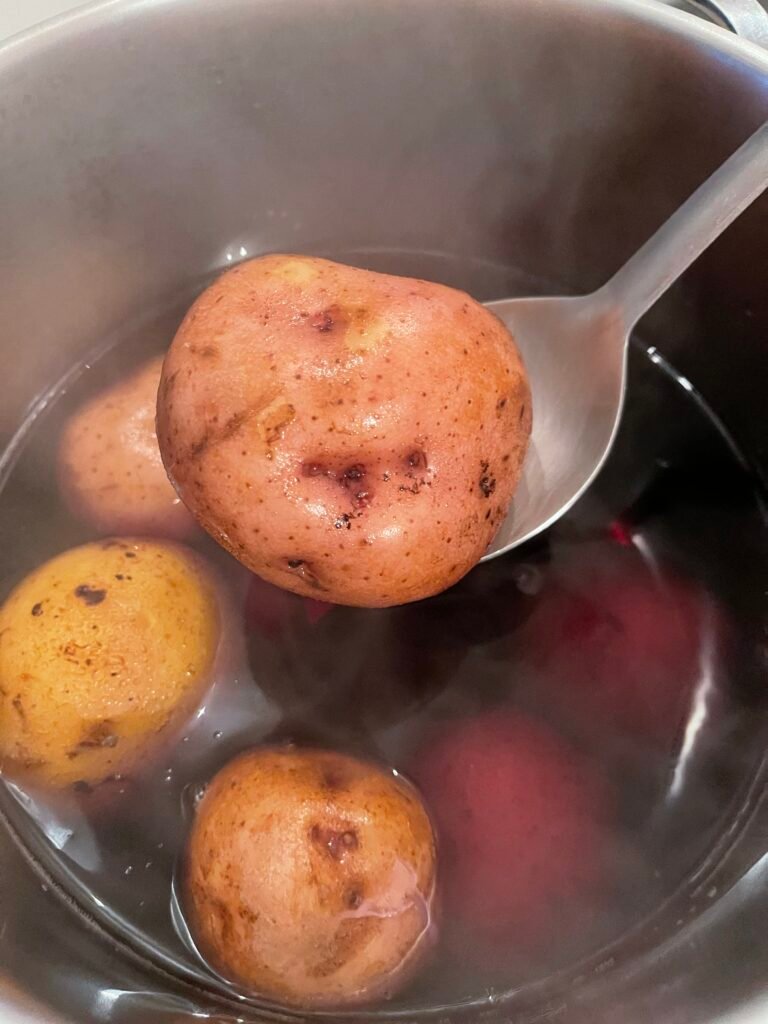 fully cooked red potato in its skin