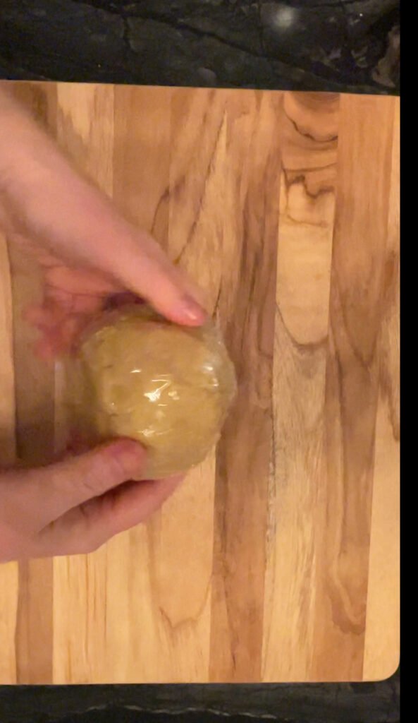 we always wrap pasta dough in a plastic wrap and let it rest before rolling the dough