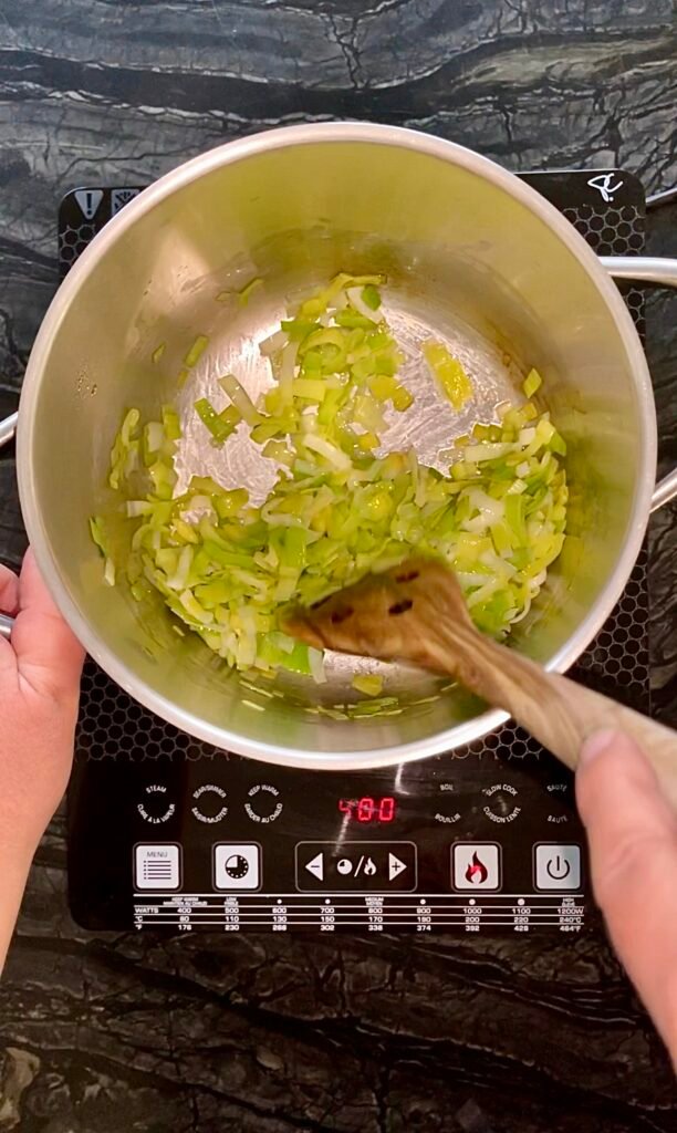 onions get stirred as we set them in a large pot