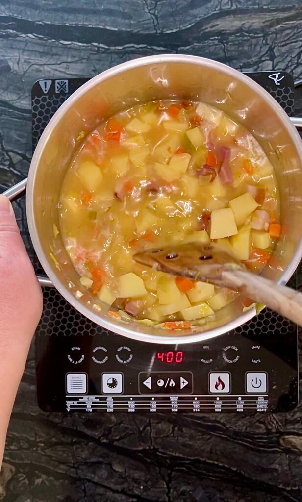 we add diced potato and stock to the cooking ingredients