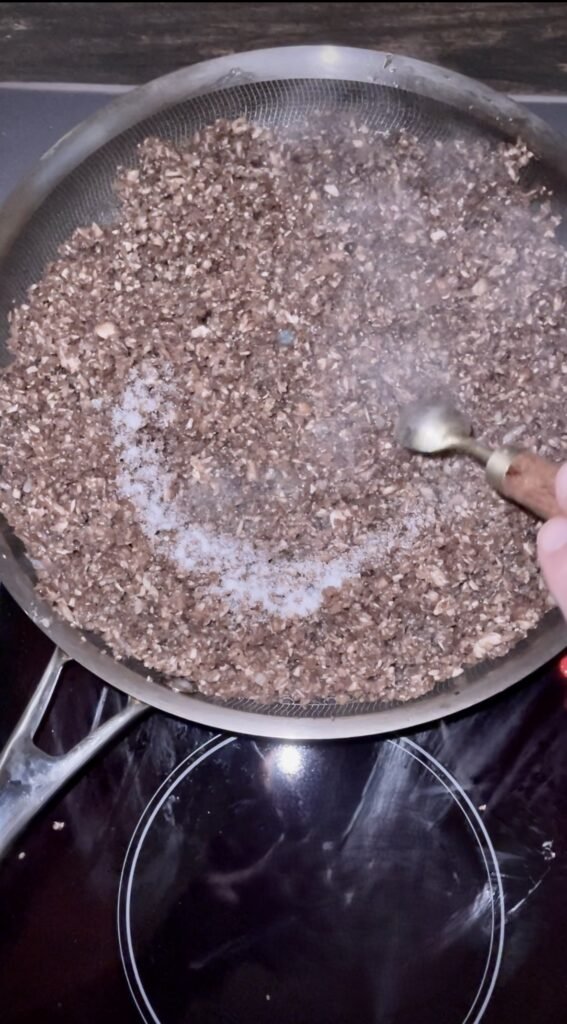 add chopped  mushrooms and salt to the pan with onions and garlic
