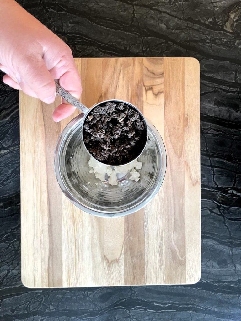 start making ravioli filling by combining softened goat cheese and mushroom duxelles