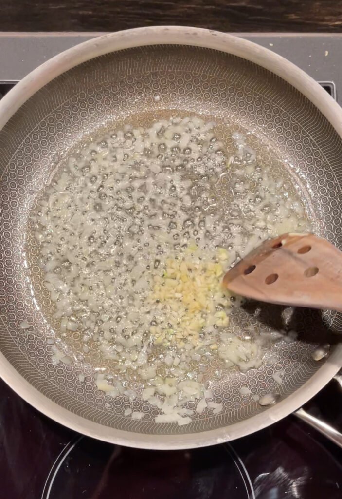 add garlic to the pan with cooked onions 