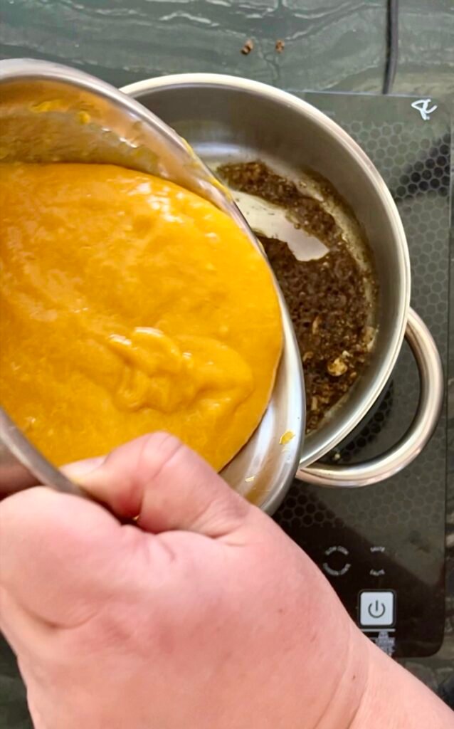 smooth mango chutney - add pureed mango to a pot with ginger-garlic & spices